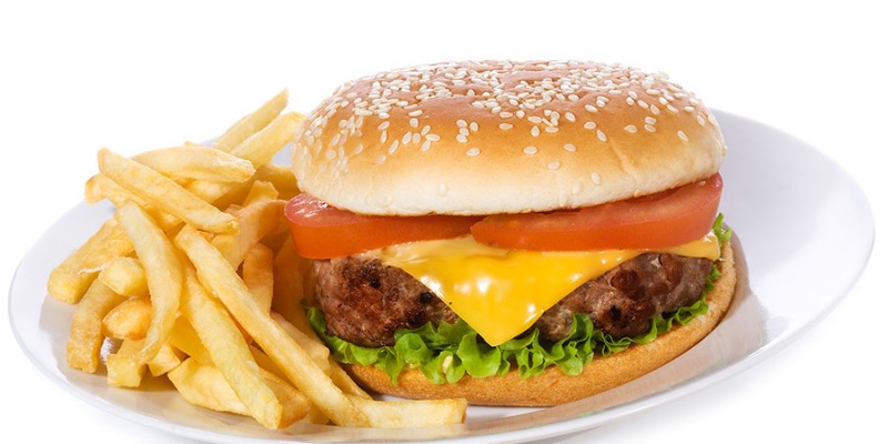 hamburger with vegetables and fries